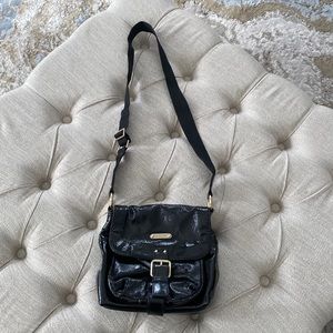 MICHAEL KORS Black Patent Leather Saddle Style Bag with gold accents